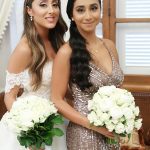 Bride and her bridesmaid with bouquets
